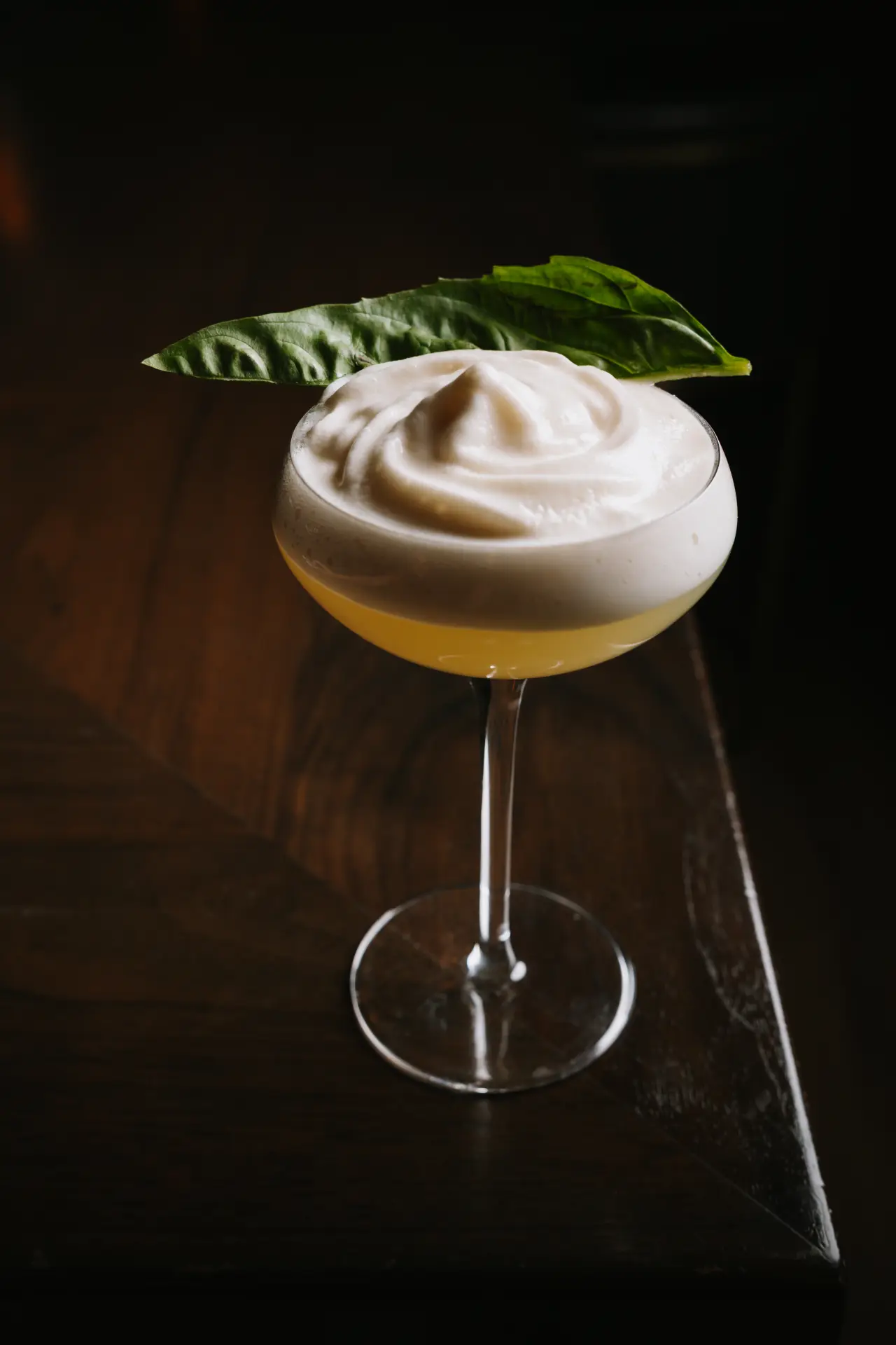 A cocktail with a foam top